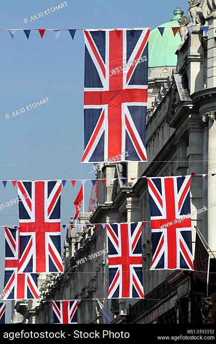 PRINCE WILLIAM AND KATE MIDDLETON ROYAL WEDDING SOUVENIRS FOR SALE IN SHOPS AND UNION JACK FLAGS DISPLAYED IN LONDON, ENGLAND, UK, APRIL 2011