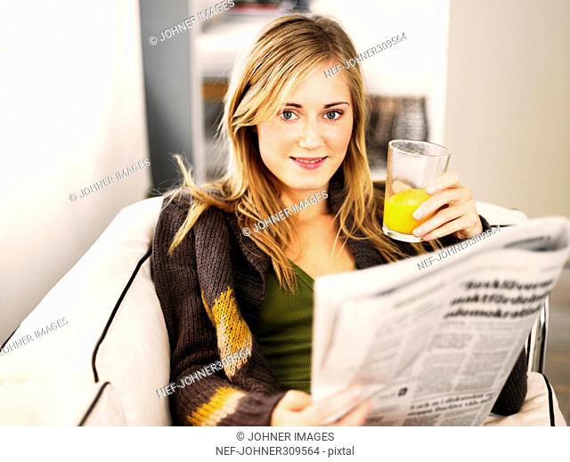 A woman reading the paper