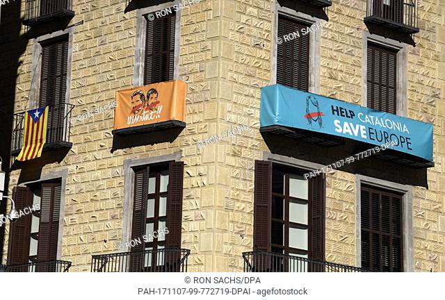 Signs on a building near the Palau de la Generalitat de Catalunya that advocates for Catalonian independence from Spain on Tuesday, November 7, 2017