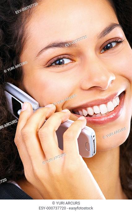 Talking business over the phone and smiling