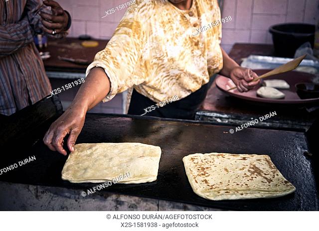 woman making bread, Azilal, Morocco