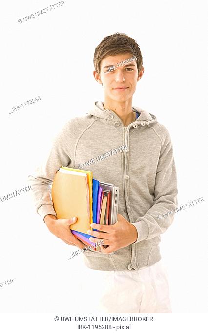 Boy holding exercise books