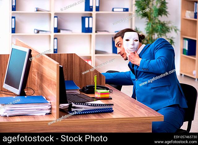 Young employee wearing mask in the office