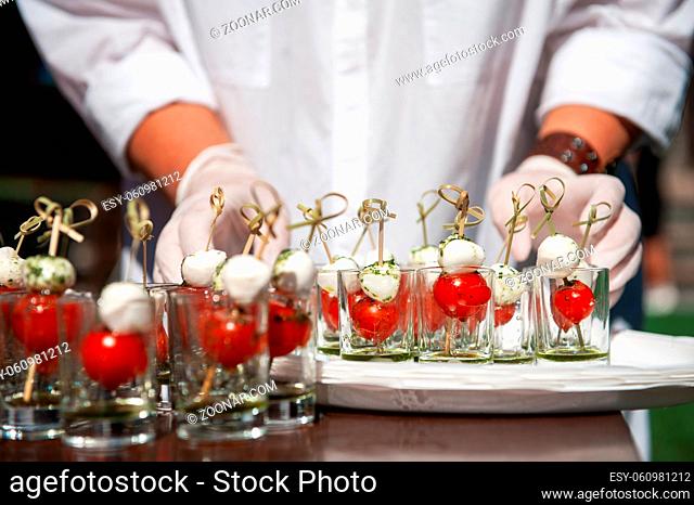 Food catering concept: Various snacks on table, outdoor banquet