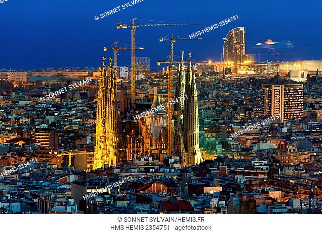 Spain, Catalonia, Barcelona, Panoramic view and skyline of the city with Sagrada Familia listed as World Heritage by the UNESCO and Agbar Tower and the...