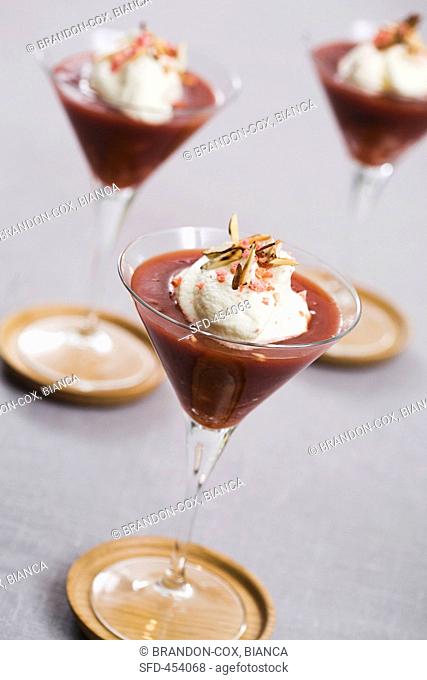 Plum dessert topped with a dollop of cream
