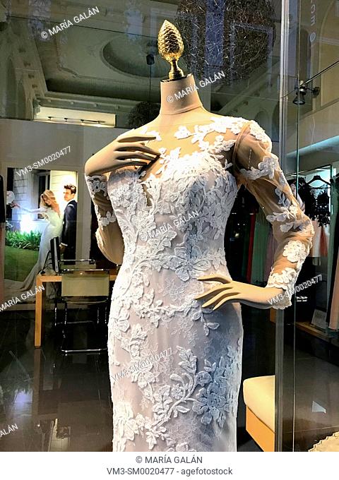 Mannequin wearing wedding dress in a shop window. Madrid, Spain