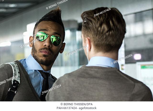Borussia Dortmund's Pierre-Emerick Aubameyang (l) and Marco Reus at the airport in Dortmund, Germany, 24 February 2016. Borussia Dortmund are on their way to...