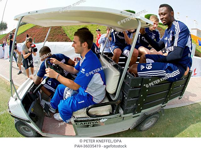 Soccer players from FC Schalke 04 are driving back to their hotel in a golf buggie over the soccer field in Doha, Qatar on January 07.01.2013