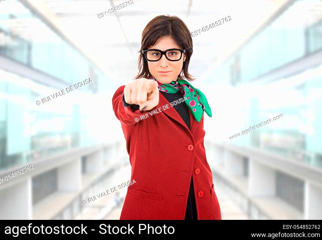 young business woman pointing at the office