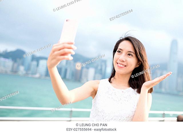 Woman take self image with cellphone
