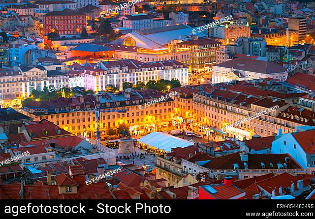 Aerial night view of Lisbon downtown square, illuminated Praca do Pedro IV square, Portugal
