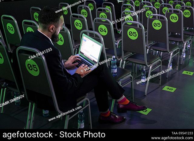 RUSSIA, NIZHNY NOVGOROD - JUNE 1, 2023: A man uses a laptop in a plenary session hall at the 8th annual Digital Industry of Industrial Russia conference at the...