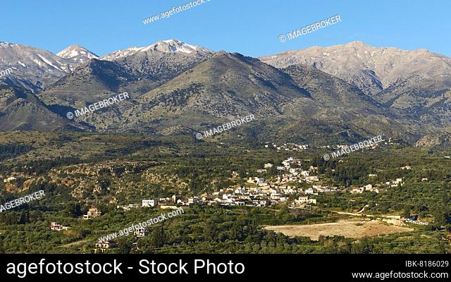 Spring in Crete, Paidochori village, Lefka Ori, White mountains, snow on the peaks, olive groves, blue cloudless sky