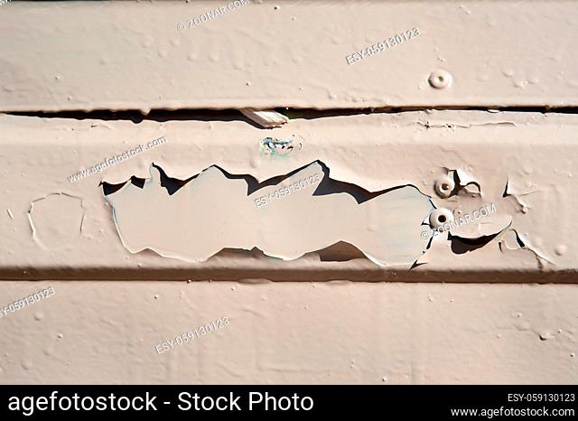 chipped metal plating on scratched wall , industrial grunge background