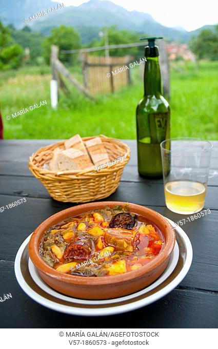Pote asturiano serving with cider. Asturias, Spain