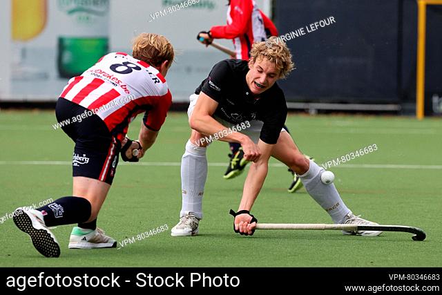 Leopold's Dimitri Cuvelier and Racing's Gaspard Xavier fight for the ball during a hockey game between Royal Leopold Club and Royal Racing Club Bruxelles