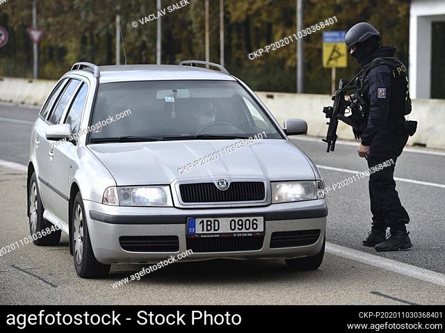 Police officer checks a car at the borders between Czech Republic and Austria in Breclav-Reinthal, Czech Republic, November 3, 2020