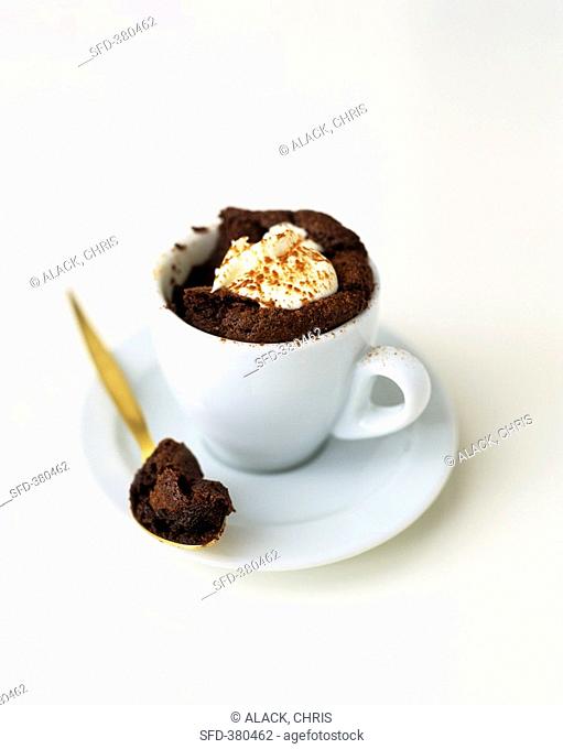 Chocolate mousse pudding in a cup, gold spoon