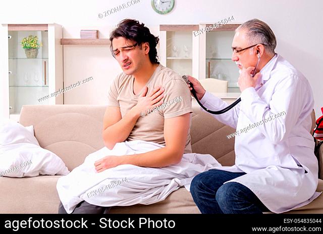 The old male doctor visiting young male patient