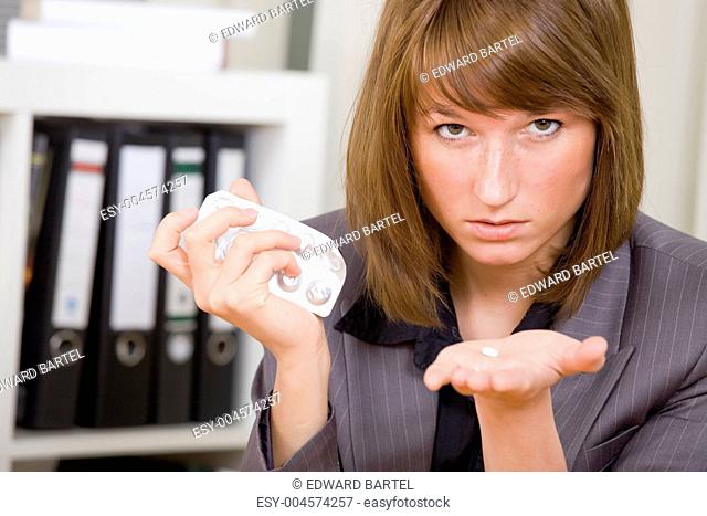 businesswoman with pills