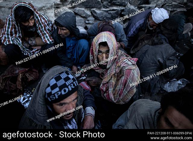 14 November 2022, Afghanistan, Kabul: Afghan men consume drugs on a street in Kabul. Drug addiction has been a long standing problem in Afghanistan