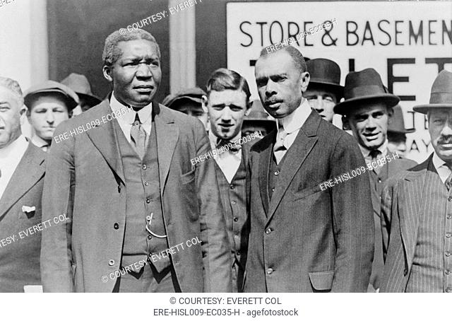 James Weldon Johnson right and Robert R. Morton left at the funeral of Progressive mayor Seth Low in 1916. Johnson 1871-1938, was a Harlem Renaissance poet