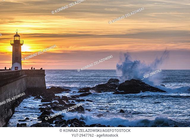View on Felgueiras Lighthouse and Atlantic Ocean waves crashing on rocks in Foz do Douro district of Porto city, second largest city in Portugal
