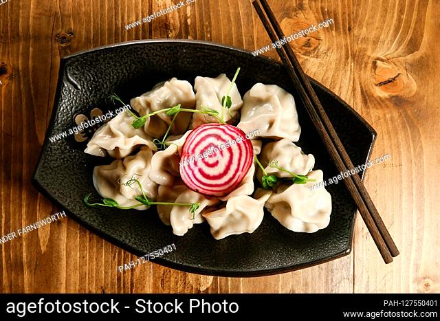 A dish of dumplings at an Asian restaurant | usage worldwide. - STOCKHOLM/Sweden
