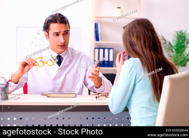 The young woman visiting male doctor oculist