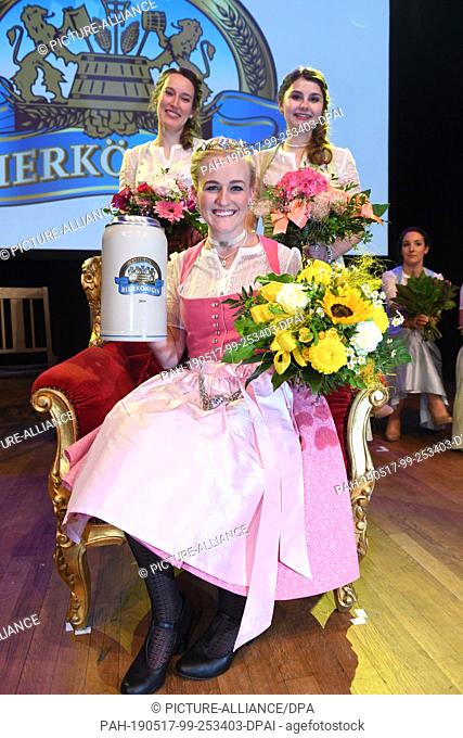 16 May 2019, Bavaria, Munich: The new beer queen Veronika Ettstaller (M) sits on her throne after her election as the 10th Bavarian beer queen