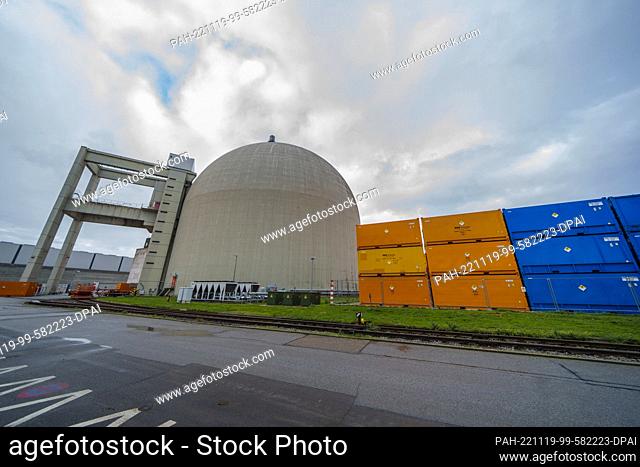 18 November 2022, Hessen, Biblis: Containers with radioactive material stand by a power plant unit. The Biblis nuclear power plant has been undergoing...