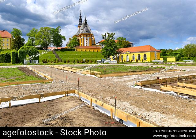 12 May 2020, Brandenburg, Neuzelle: The construction site of the extension of the monastery garden with the catholic church in the background