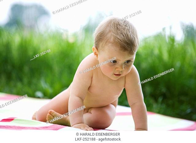 Naked baby on blanket, 9 months