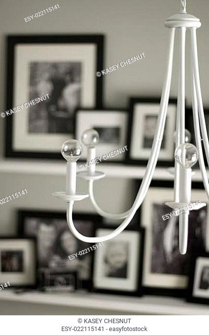 white chandelier hanging in modern house portrait view
