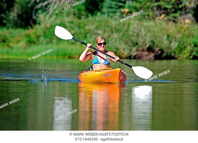 Kayaking on the North Fork of the Payette River near Payette Lake and the city of McCall in the Salmon River Mountains of central Idaho
