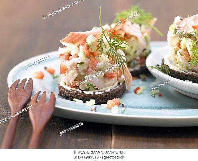 Trout tartare on Pumpernickel bread rounds