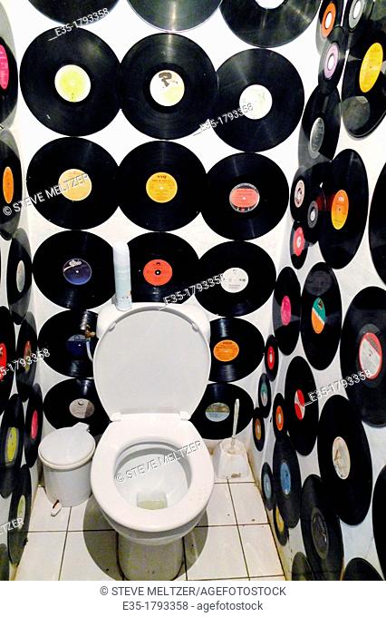 Old Vinyl LPs decorate the toilet of a cafe in Agde, France