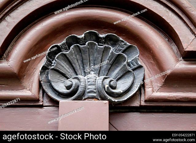 a beautiful wooden ornament on top of a wooden door