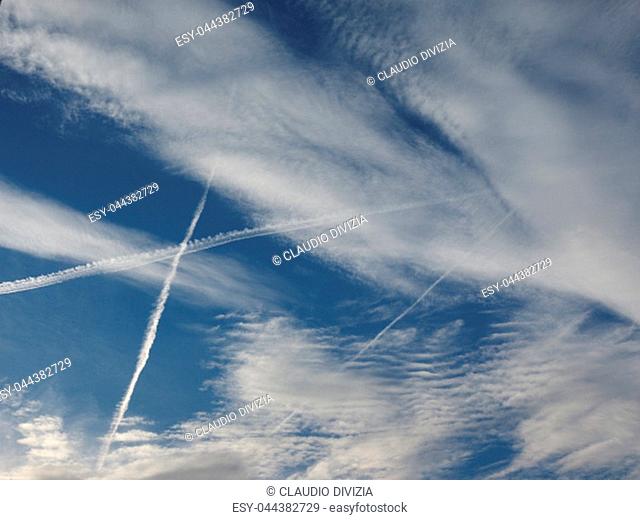 blue sky with plane vapour trails (aka contrails, short for condensation trails)