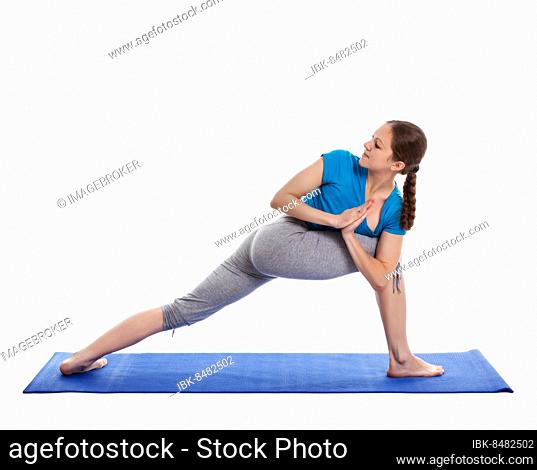 Yoga, young beautiful woman yoga instructor doing Revolved Side Angle Pose (Parivrtta Parsvakonasana) exercise isolated on white background