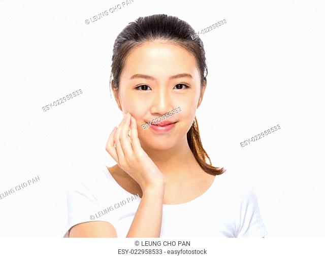 Asian woman apply skincare on face