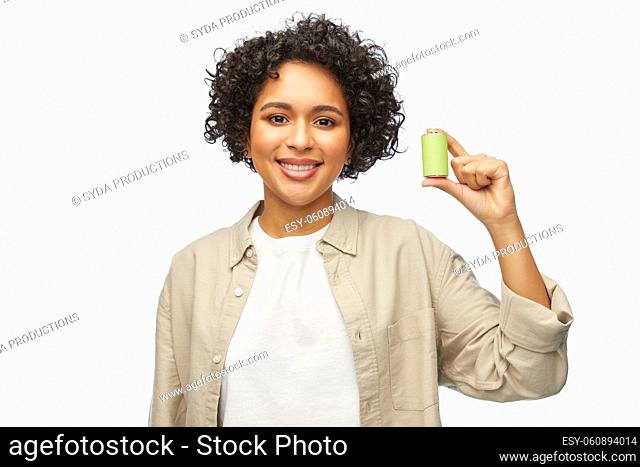 smiling woman with alkaline battery
