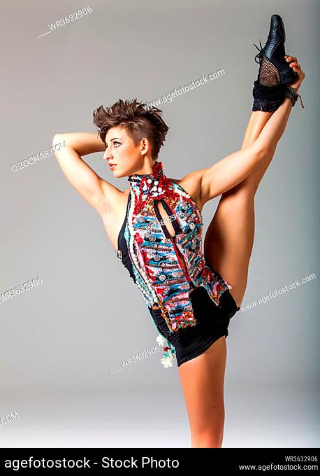 pretty brunette punk woman in an athletic and flexible pose