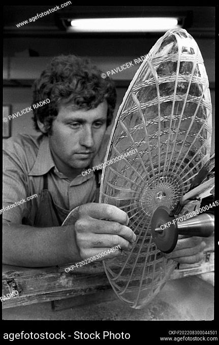 ***AUGUST 1, 1978, FILE PHOTO***Glass cutter works on patterns and designs on a glass bowl with rich decoration in Bohemia Glassworks in Brodce in the Trebic...