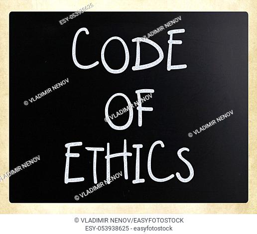 """""Code of ethics"" handwritten with white chalk on a blackboard