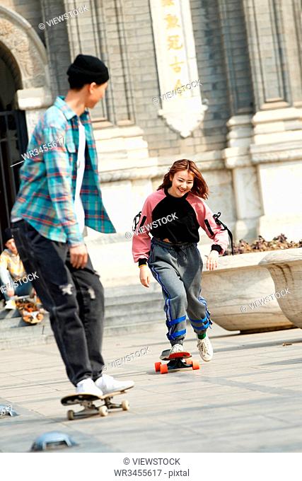 Young people skateboarding