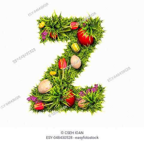 Easter holiday letter Z made of fresh green grass and Easter eggs isolated on white background