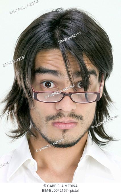 Young Hispanic man wearing eyeglasses