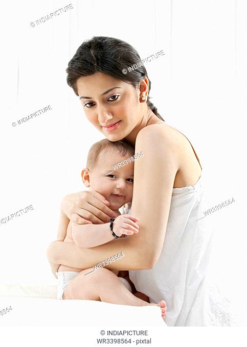 Mother hugging her baby